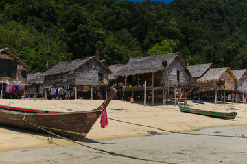 The Moken Sea Gypsy Village at Koh Surin Tai in the Mu Ko National Park, Surin Islands of Thailand with its thatched houses on stilts.