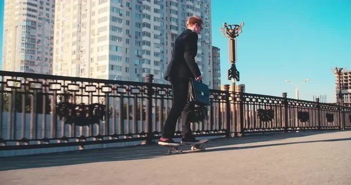 Office worker skateboarding in the city instead of office routine
