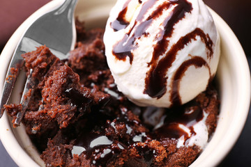 Chocolate lava cake with ice-cream and fork, close-up