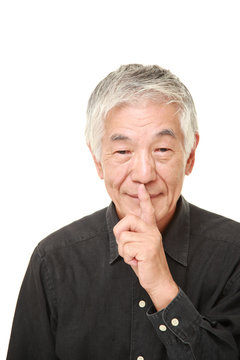 senior Japanese man whith silence gestures 