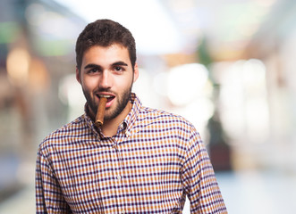 portrait of a handsome man smoking a cigar