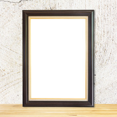 Blank wood frame on wood table white wall background