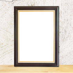 Fototapeta premium Blank wood frame on wood table white wall background