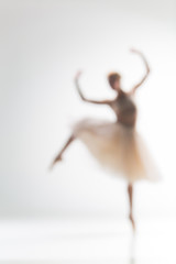 Blurred silhouette of ballerina on white background © master1305