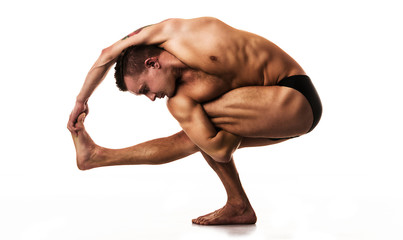 young man doing yoga and gymnastics, white background
