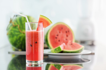 A glass of watermelon juice on kitchen table