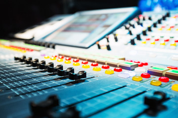 audio sound mixer with buttons and sliders . A little of DOF.