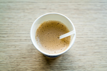 Coffee cup top view on wooden table background