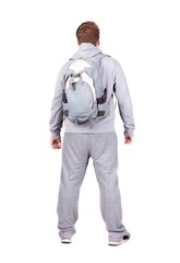 Fototapeta premium Back view of man with backpack looking up.