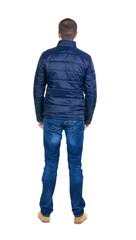 Back view of handsome man in blue windcheater looking.