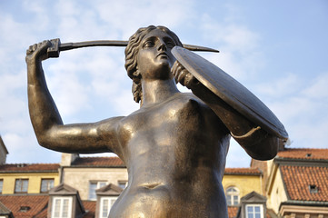 Mermaid of Warsaw, symbol of the city of Warsaw, at the Old Town Market Square, Poland