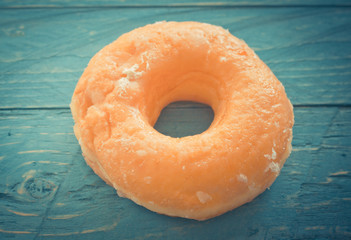 Fototapeta na wymiar Delicious donuts on wooden background