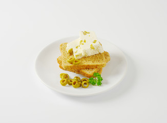 sandwich bread and fresh cheese with olives