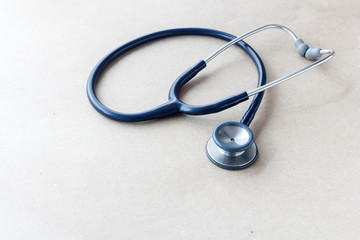 stethoscope on brown background