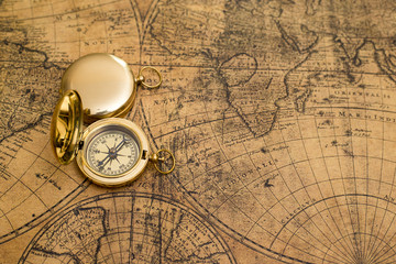 old compass on vintage map