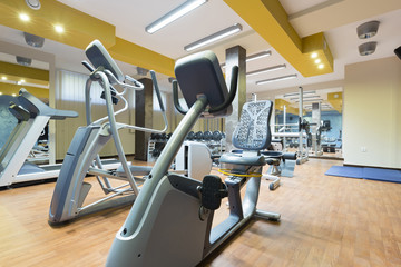 Fototapeta na wymiar Hotel gym interior with equipment