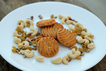 cookies on plate with dry fruits