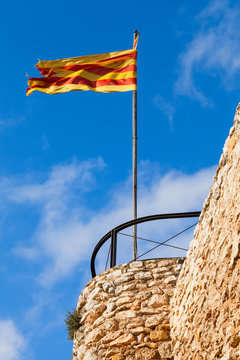 Flag of Catalonia waving on the wind
