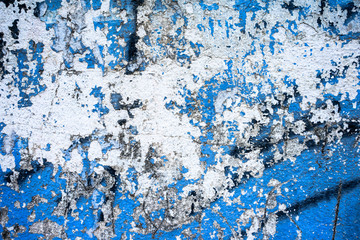 Close-up of cracked blue cement wall