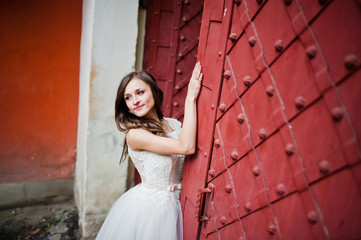 Fototapeta premium Bride posed near steel gate
