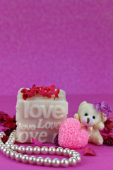 Small teddy bear with Love box.  Pink Background