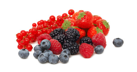Stack of different garden berries (isolated)