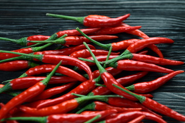 Red pepper on old wooden table.