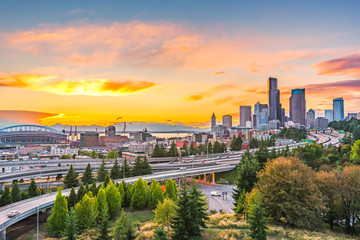 scene of Seattle skylines and Interstate freeways in the sunset.