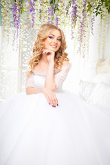 photo of a beautiful blonde bride in a luxurious wedding dress in elegant expensive interior