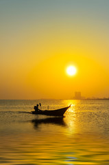 silhouette fishing boat