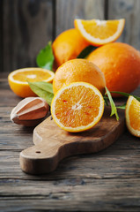 Fresh sweet oranges on the wooden table