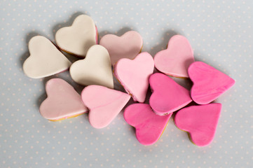 Fototapeta premium Pink cookies, heart shape, blue background