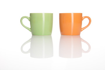 two cups standing on white background 