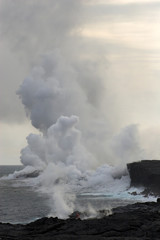 Fototapeta na wymiar Lava flowing into the ocean