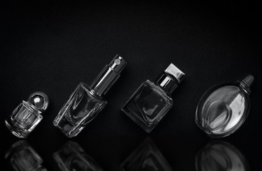 different perfume bottles on the dark background