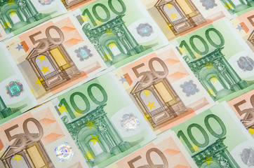 Obraz na płótnie Canvas 50 and 100 euro bills