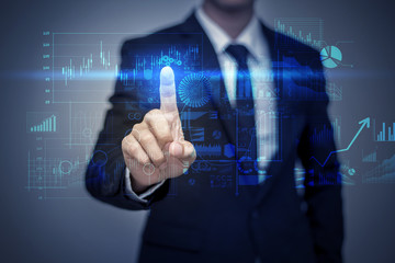 Businessman in suit working with digital virtual screen