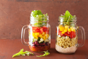 vegan quinoa bean vegetable salad in mason jars