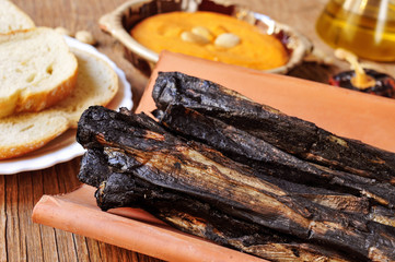 barbecued calcots, sweet onions, and romesco sauce typical of Ca