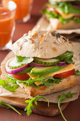 tomato avocado cheese sandwich with cucumber onion