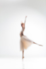 Blurred silhouette of ballerina on white background © master1305