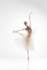 Blurred silhouette of ballerina on white background - obrazy, fototapety, plakaty