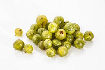 Gooseberries fruits on white background. Ripe summer fruits back