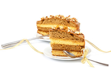 Piece of cake on a saucer with a spoon.