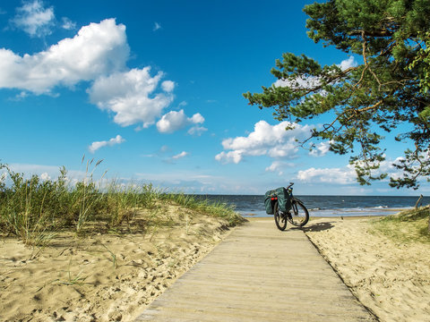 Bicycle standing on a wooden path on the coast of Baltic