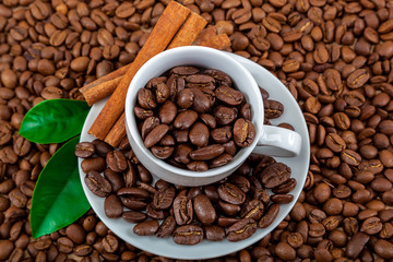 Coffee beans with cinnamon as a background