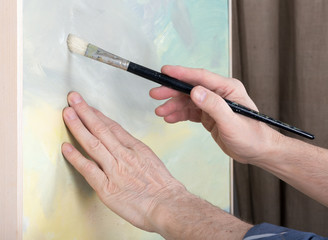 An artist painting in studio