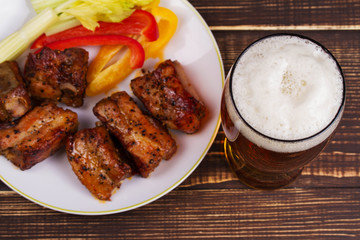 Glass of Beer, Pork Ribs and Vegetables