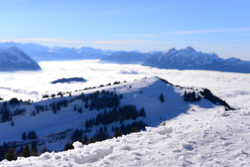 Close-up snow with the sea of clouds background; the Rigi Kulm i