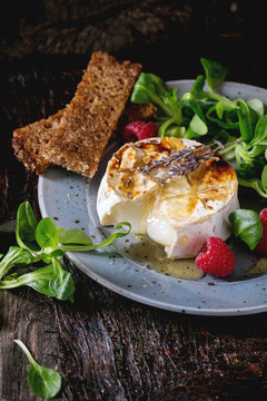 Baked Goat cheese with honey and raspberries